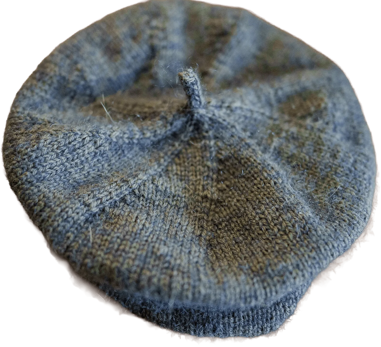 A hand-knit wool beret in heathered blue and green